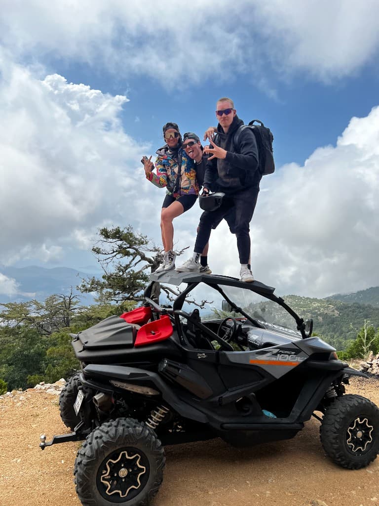 Friends on an off-road buggy in the mountains