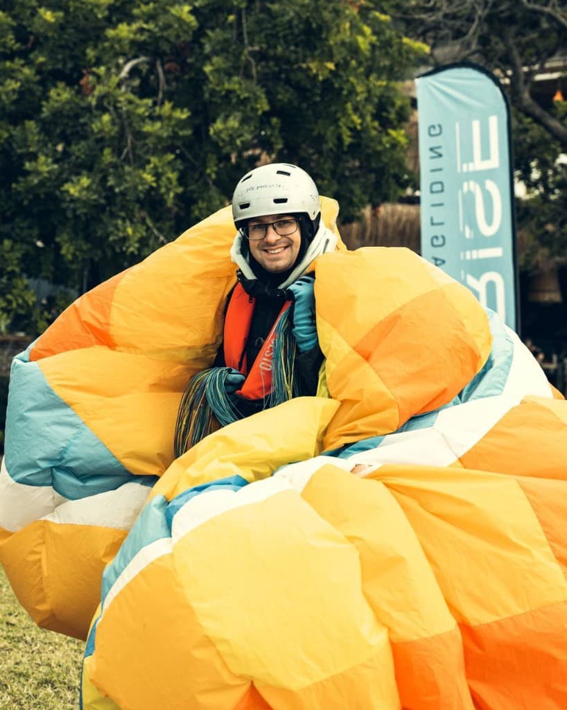 Pilot smiling wrapped in a bright wing