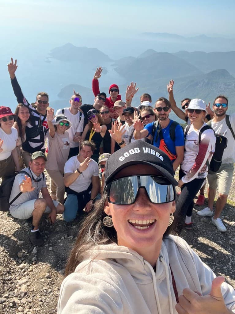 Camp group selfie on a mountain top