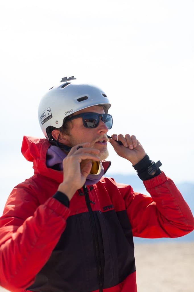 Instructor fastening a flight helmet