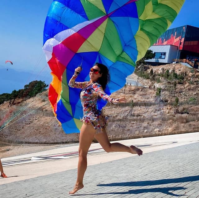 Pilot dancing with a colourful canopy