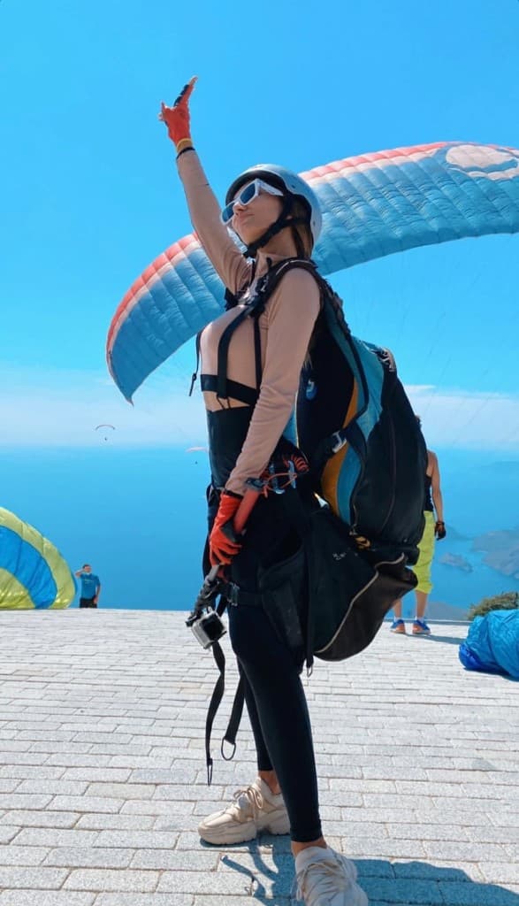 Pilot pointing to the sky before take-off above the sea