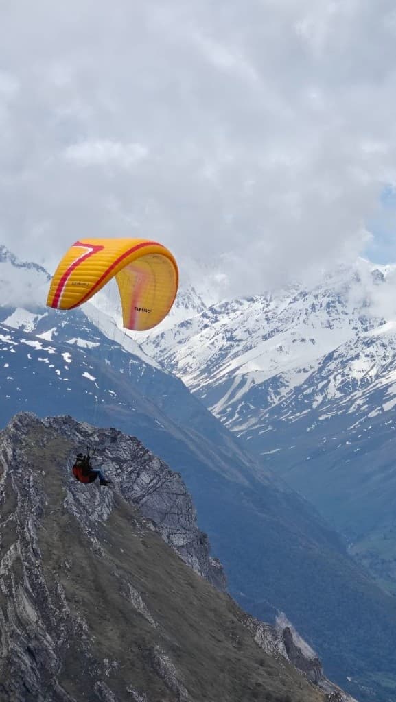 Yellow wing over snowy high peaks — Himalayas
